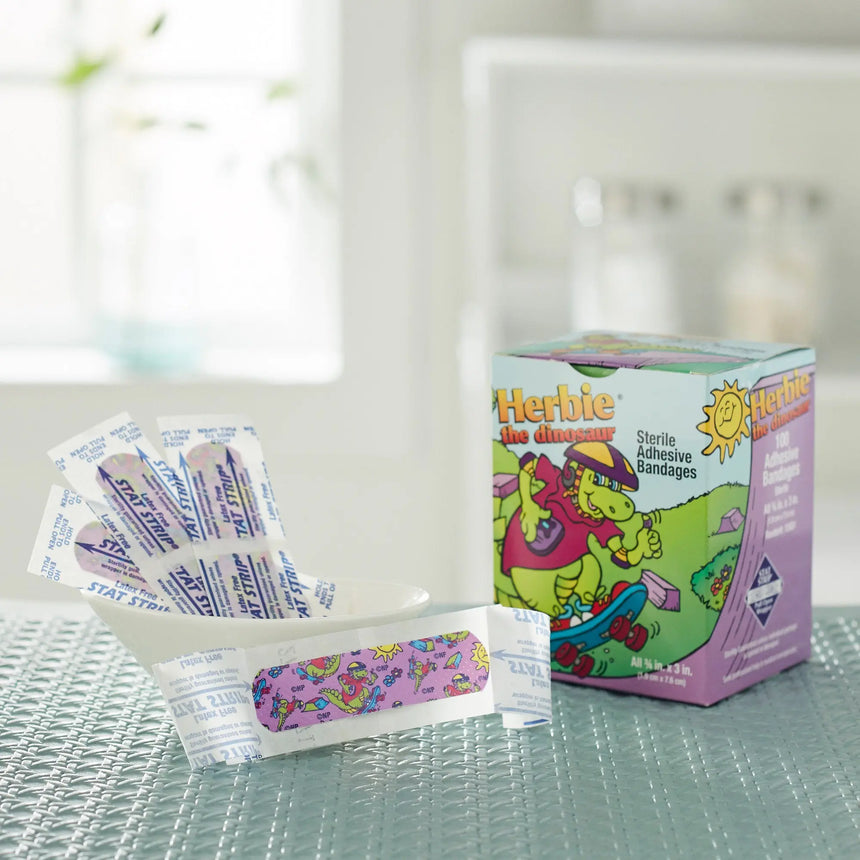 American® White Cross Stat Strip® Kid Design (Herbie the Dinosaur) Adhesive Strip, ¾ x 3 Inch - getMovility