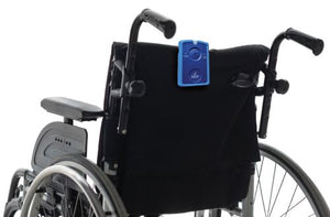 Wheelchair with a black cover and blue device attached on a white background